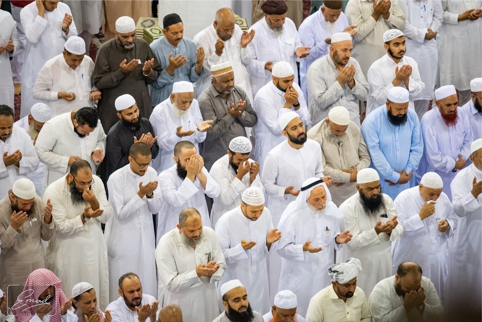Rows of pilgrims making dua together inside the Haram