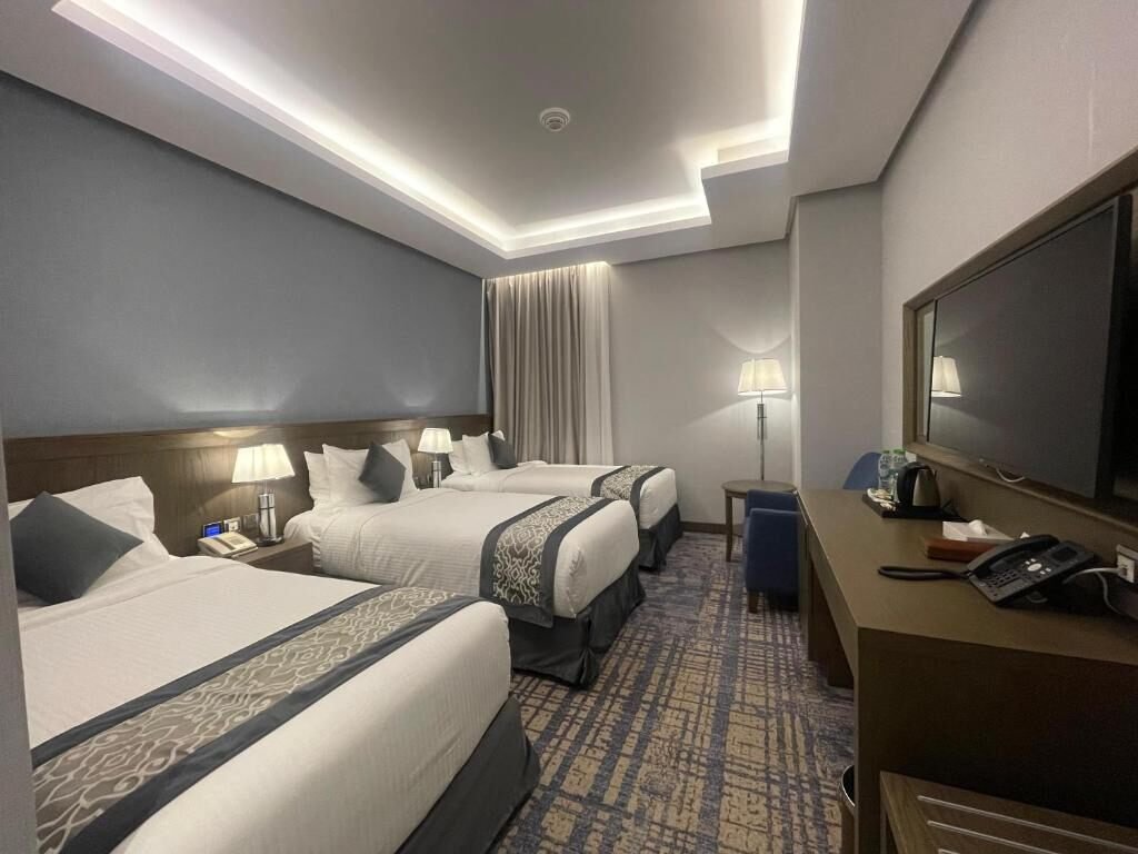 Representative triple guest room at Maien Taibah Hotel