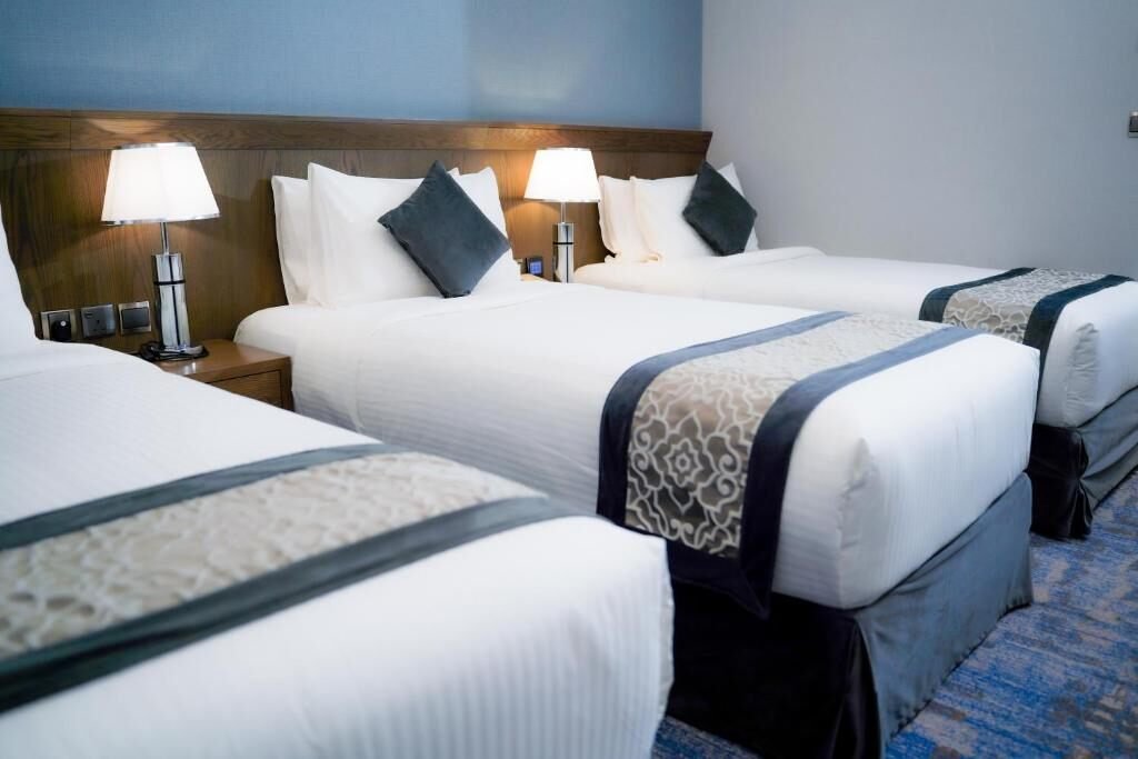 Representative multi-bed guest room at Maien Taibah Hotel