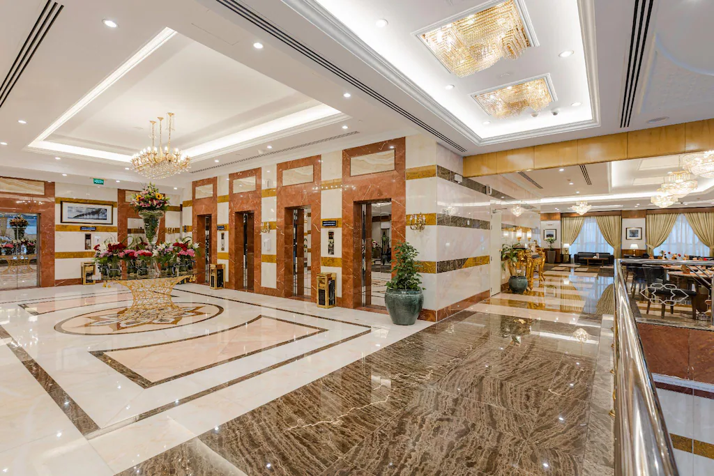 Marble lobby floor and elevators at Maden Hotel