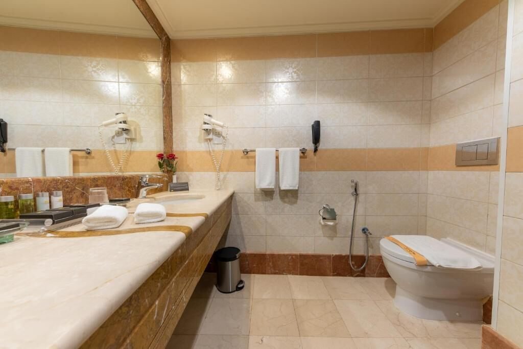 Bathroom with twin vanity at Dar Al Ghufran