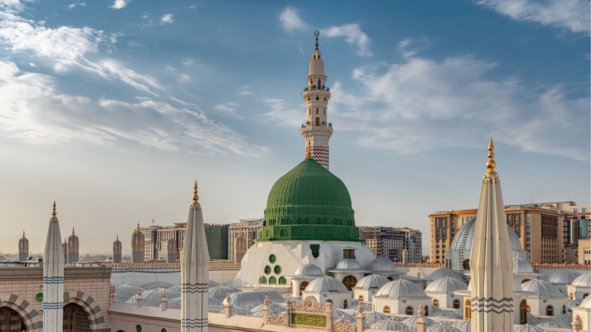 The Green Dome and minarets of the Prophet's Mosque with the hotel towers of the central area behind