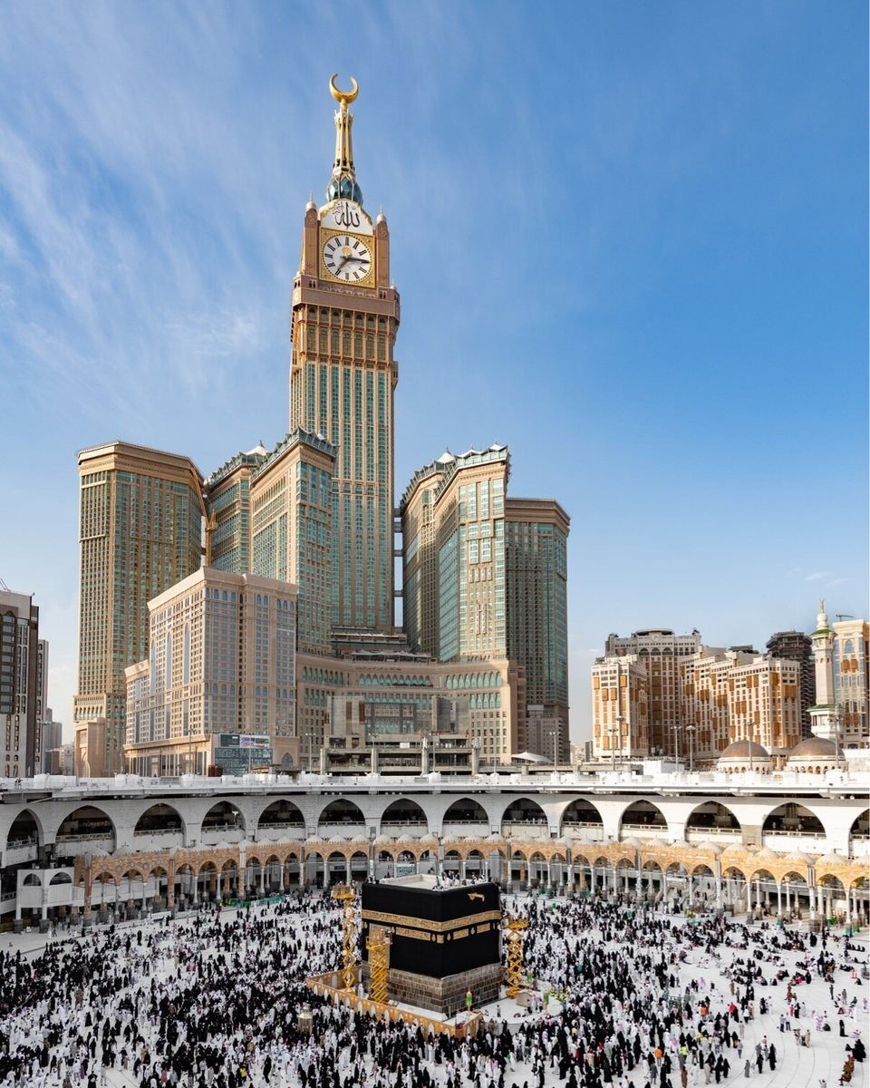 The clock tower and surrounding hotels seen from the Haram in Makkah, looking upward