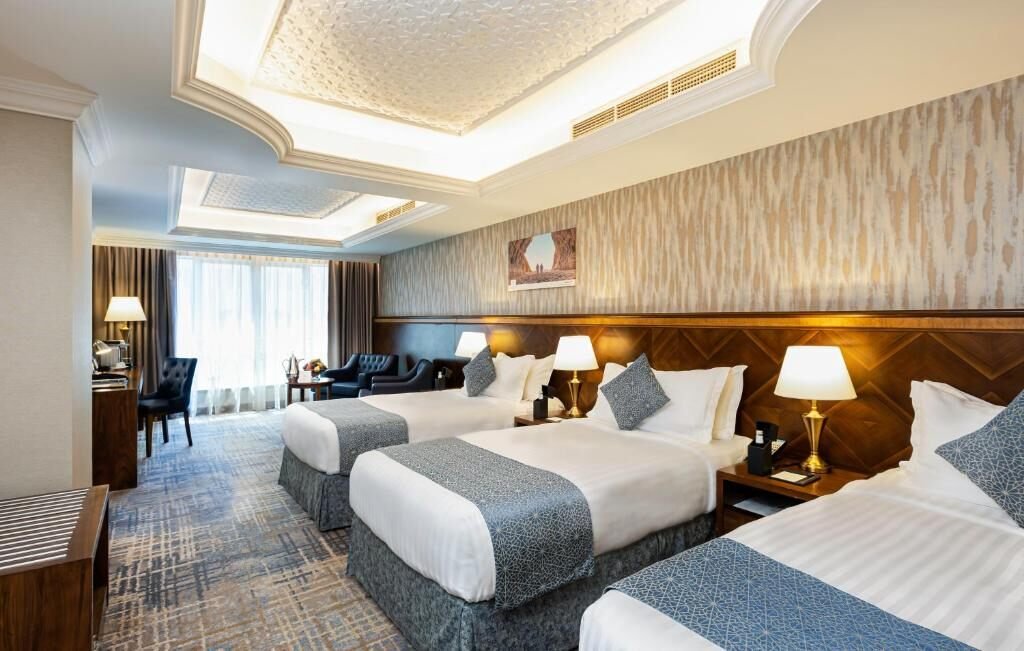 Representative triple guest room at Maden Hotel