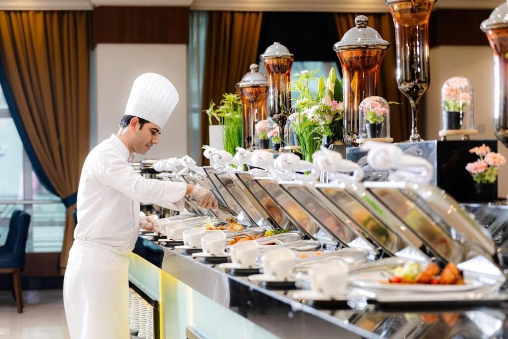 Chef at the buffet line at Maden Hotel